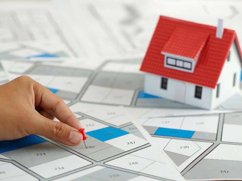 Property plat map and model building used to review boundaries and ownership details during an ALTA Survey before closing